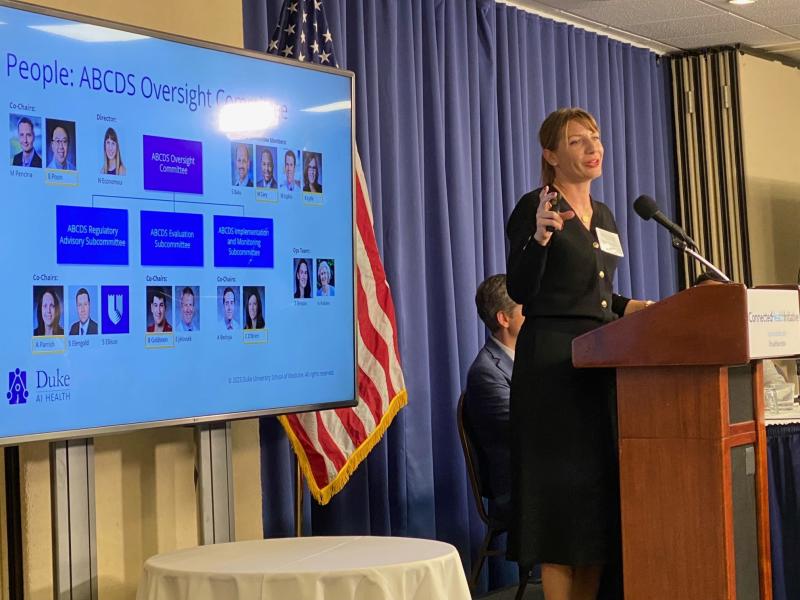 Nicoleta Economou, PhD, at a podium